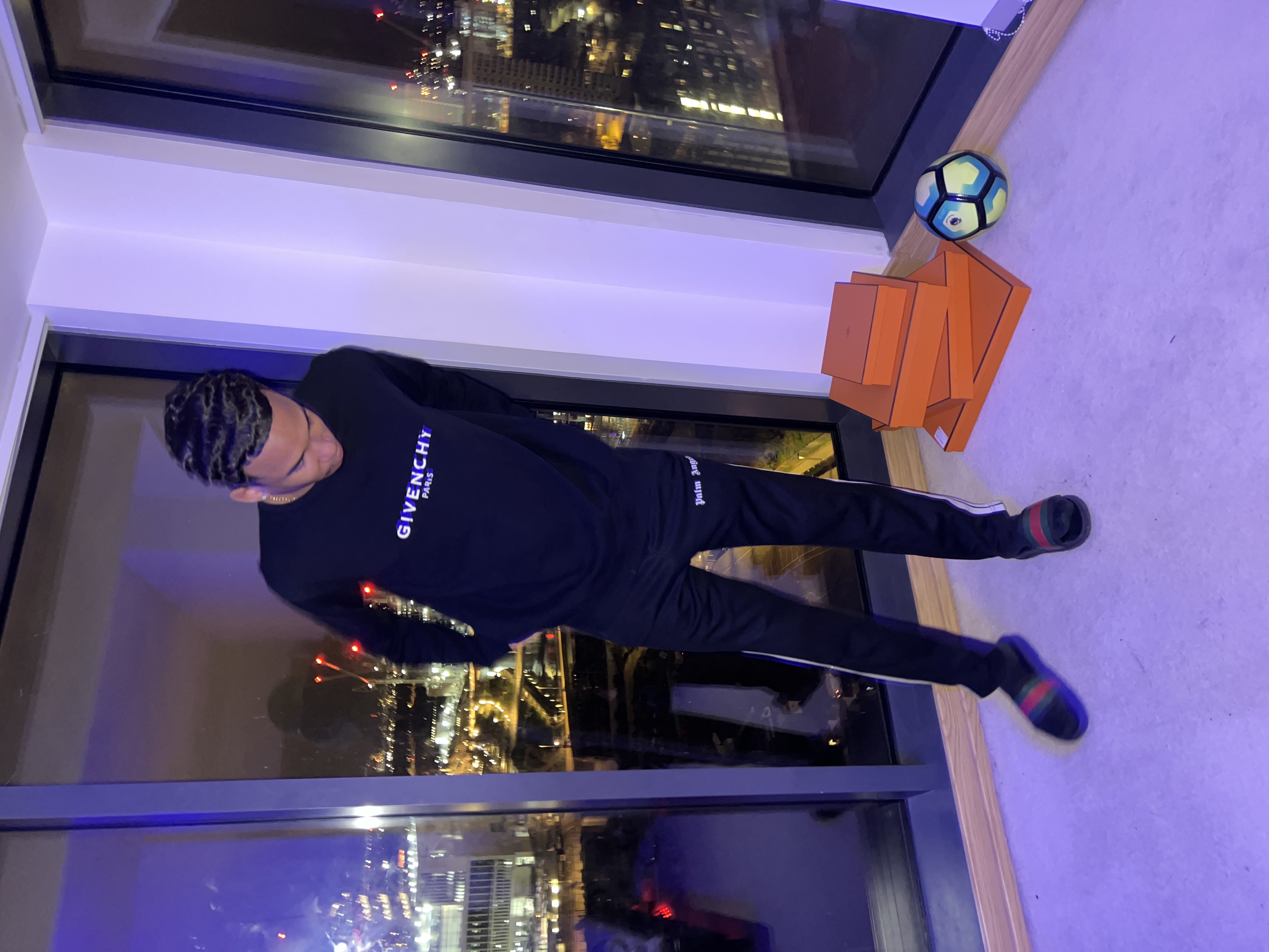 Joshua Arthur (JJDREAMSS) — Waves, a football and Givenchy against the skyline