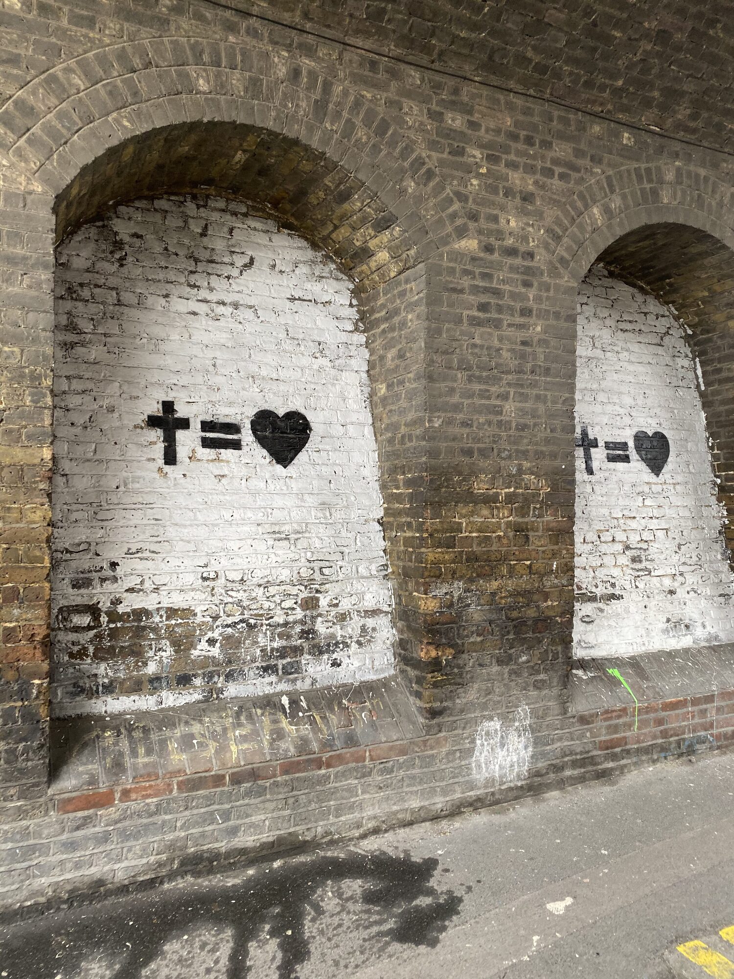 Joshua Arthur (JJDREAMSS) — The CROSS = LOVE mural, and the Joshua 1:8–9 echo the whole estate is named for