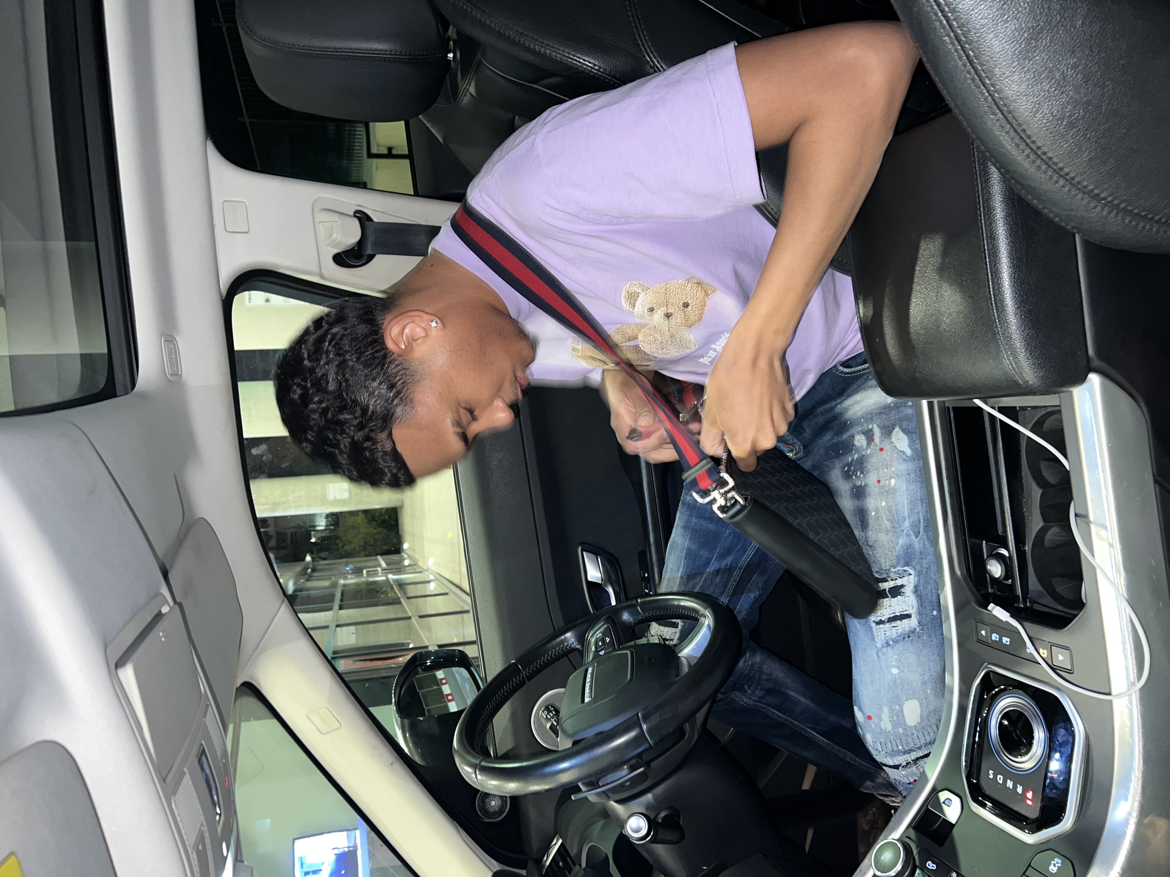 Joshua Arthur (JJDREAMSS) — Sat in the Range Rover — purple Palm Angels, DSquared2 jeans, Gucci messenger