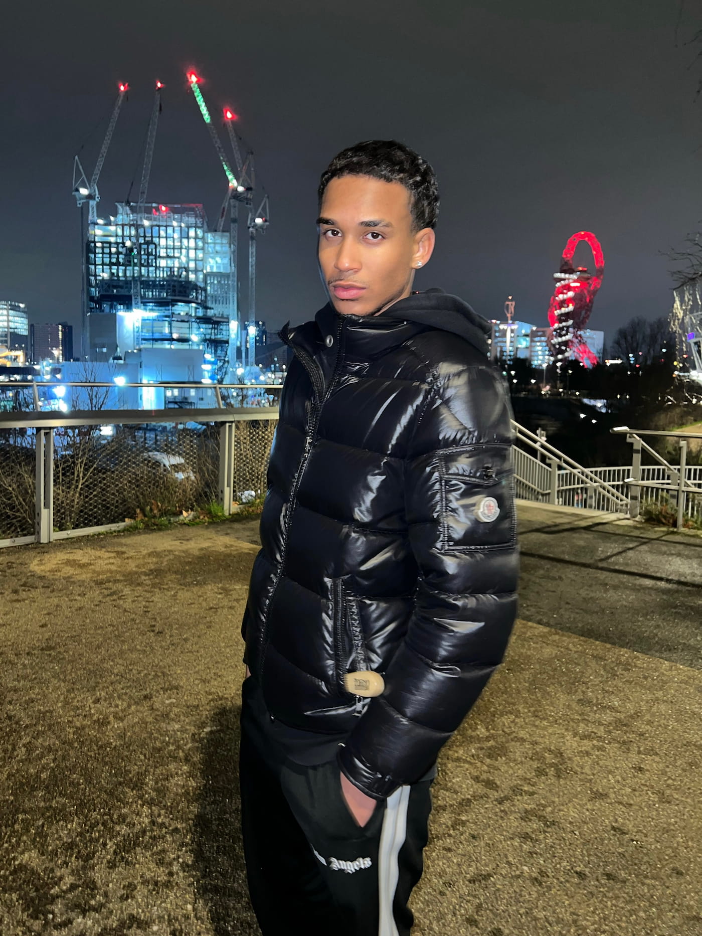 Joshua Arthur JJDREAMSS at Queen Elizabeth Olympic Park Stratford East London at night ArcelorMittal Orbit sculpture 2022 Nigerian Norwegian British entrepreneur content creator