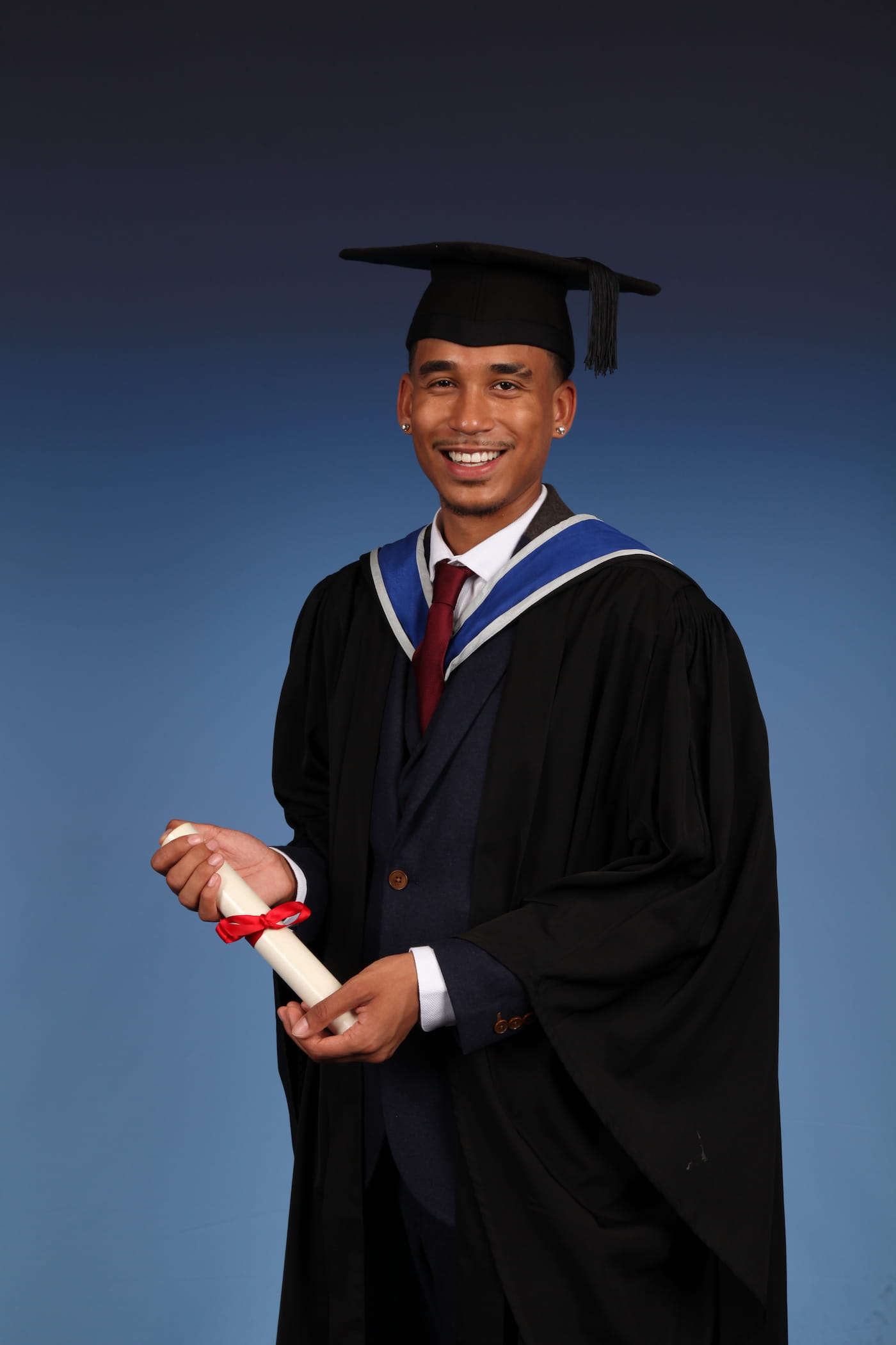 Joshua Arthur — First Class Honours, QMUL, 14 July 2022 Joshua Arthur First Class Honours graduation professional studio photograph cap and gown Queen Mary University of London QMUL Russell Group July 14 2022